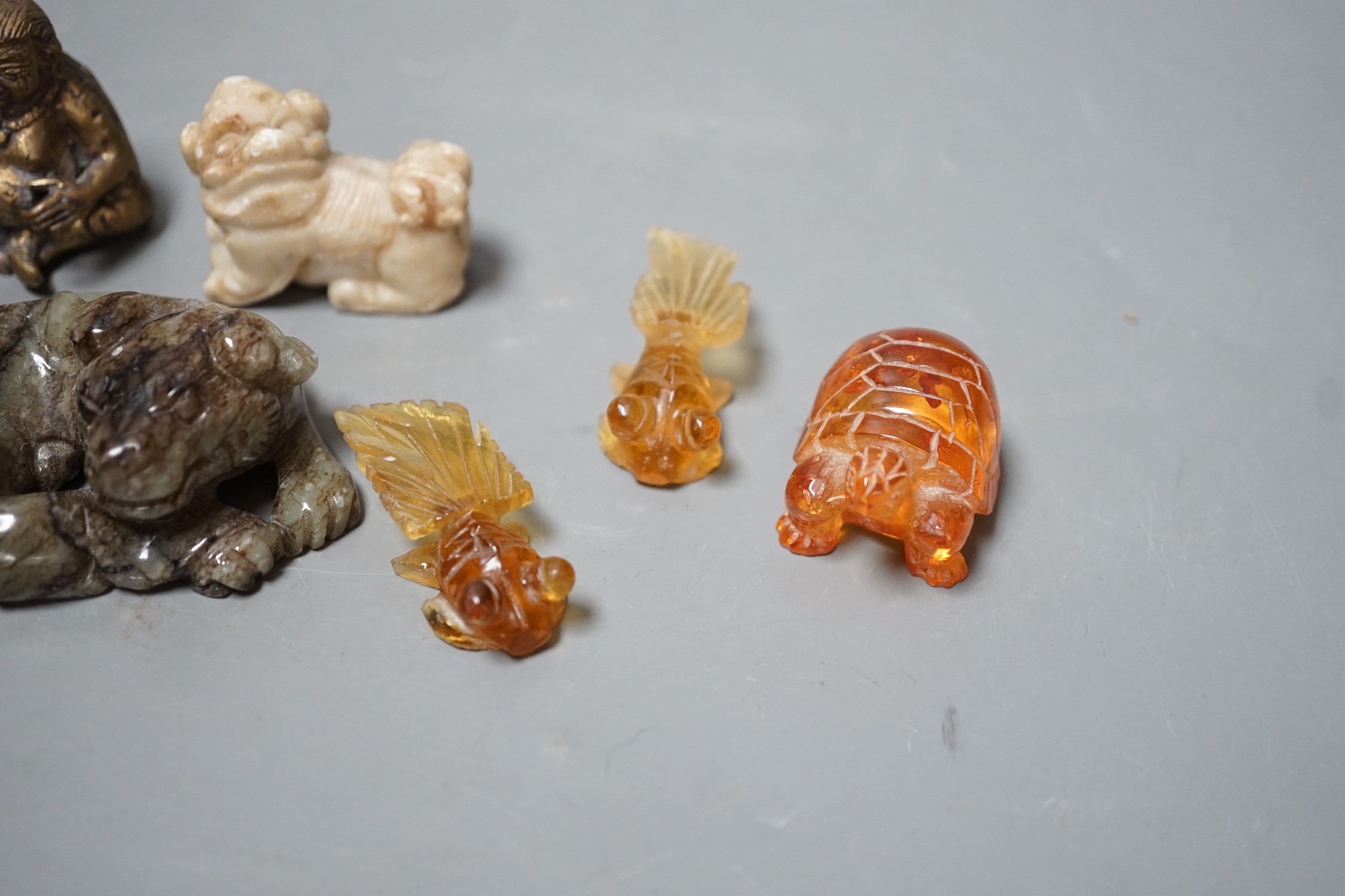 A group of Chinese jade, hardstone, faux amber carvings and models